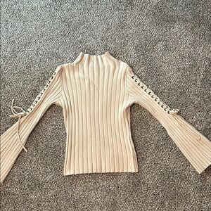 Chic Beige Ribbed Sweater with Lace-Up Sleeves